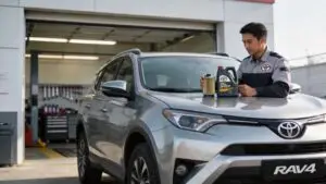 Mechanic with oil and filter by Toyota RAV4