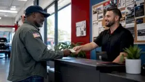 Veteran receiving hero discount at auto shop counter