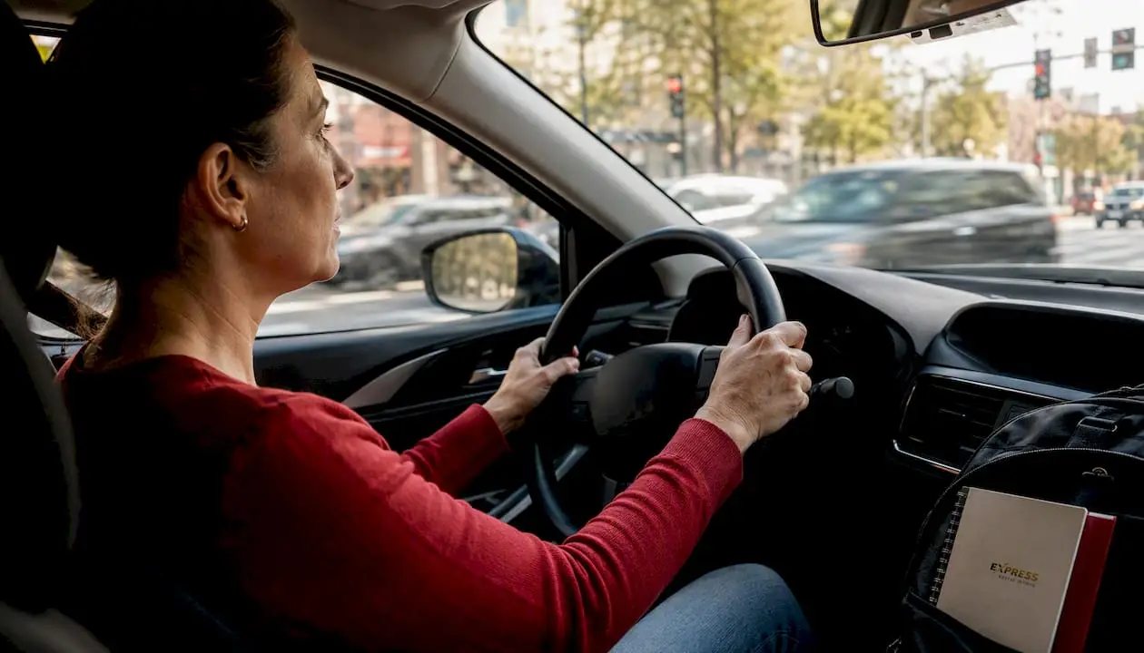 Driver braking with ABS activation visible in car interior