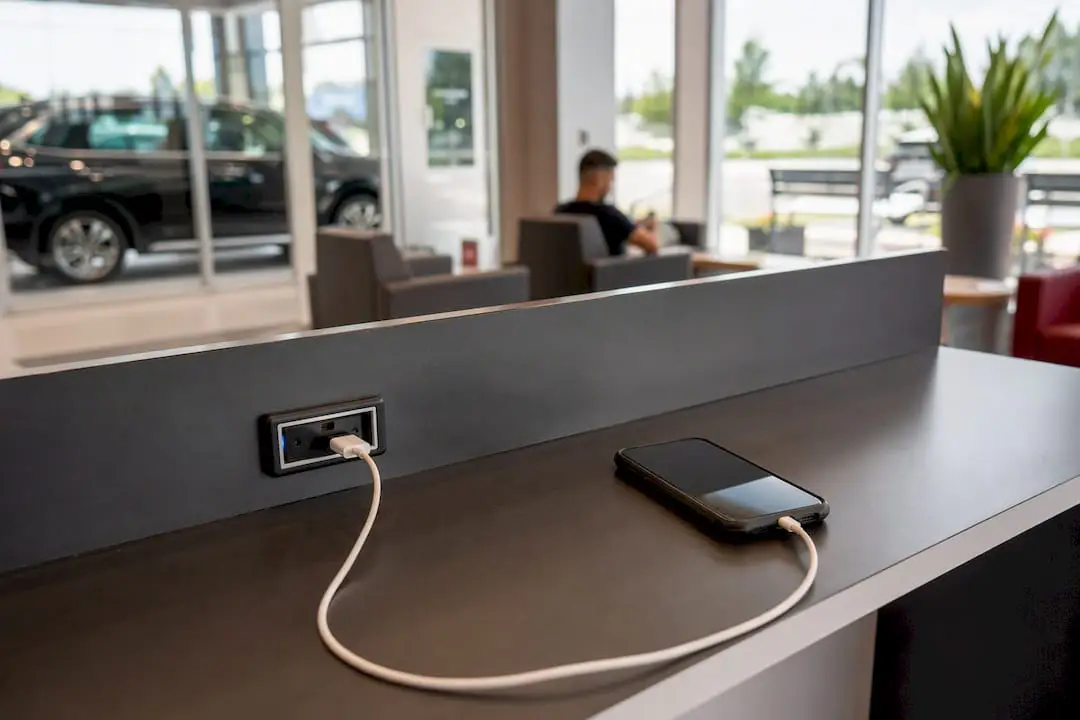 Smartphone charging in auto service waiting area
