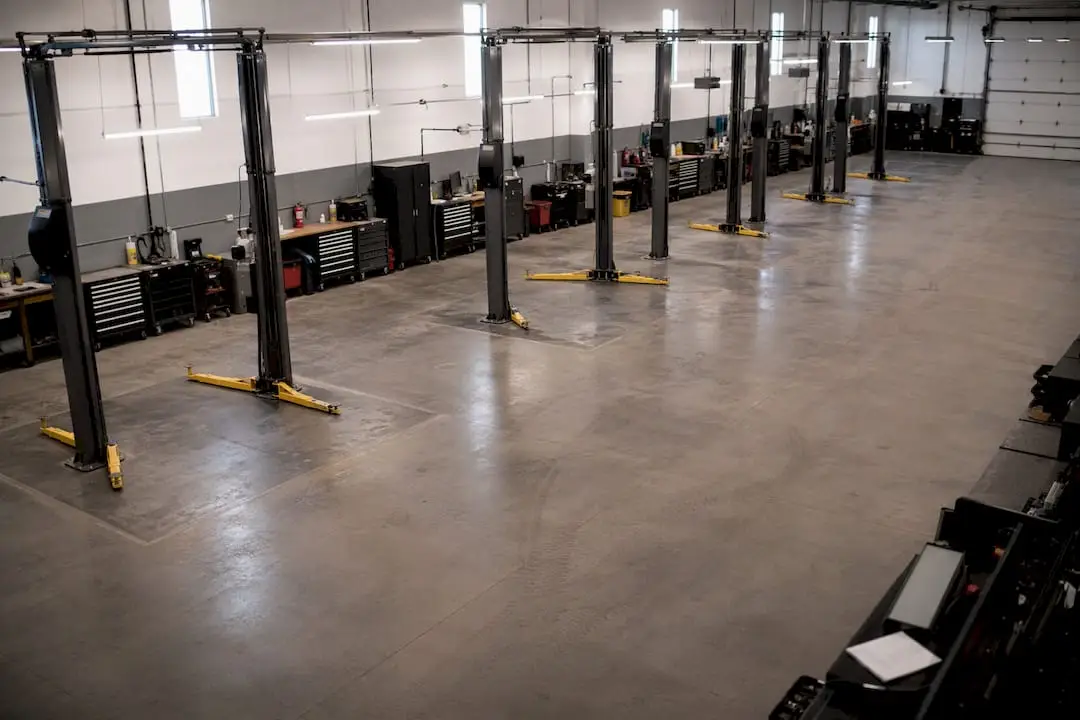 Organized auto shop floor and lifts ready for fleet service