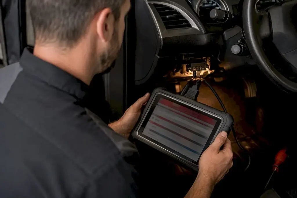 Technician reviewing vehicle live data scan